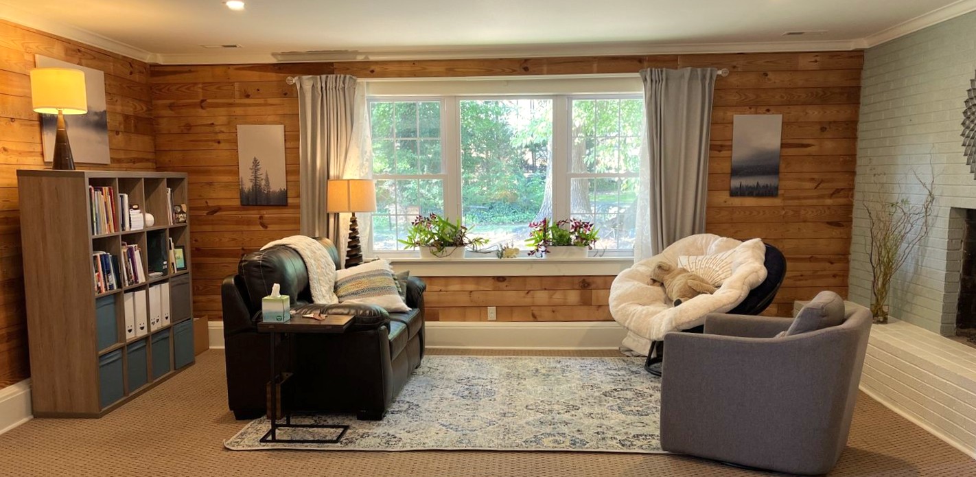Barbara Brown's mental health therapy office at Creative Perspectives in Mount Holly. It features a large picture window looking out the lush gardens.